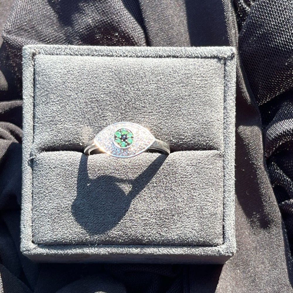 Evil eye ring with green stones